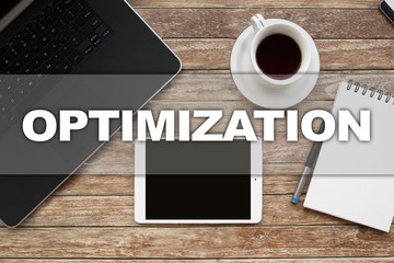Tablet on desktop with optimization text.