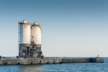  Industrial deposit on wharf at sea