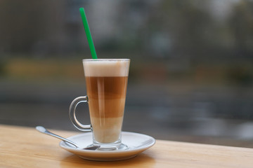 latte cup on the background of the city