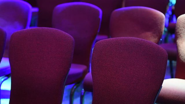 Stage lights tests and conference chairs before event