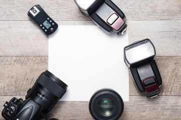 Photographer's equipment on the floor in a room with copy space.