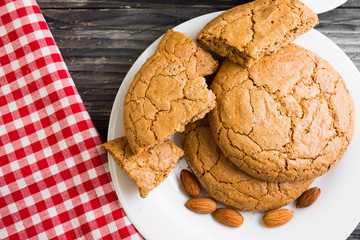 Cookies with almonds on a white plate. Tasty dessert.