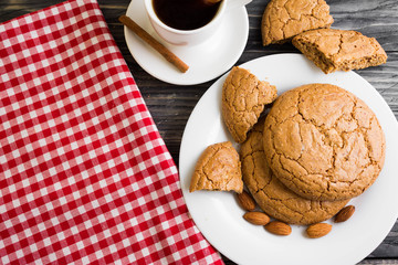 Cookies with almonds on a white plate. Tasty dessert.