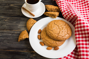 Cookies with almonds on a white plate. Tasty dessert.