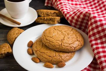 Cookies with almonds on a white plate. Tasty dessert.