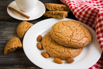 Cookies with almonds on a white plate. Tasty dessert.