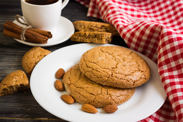 Cookies with almonds on a white plate. Tasty dessert.