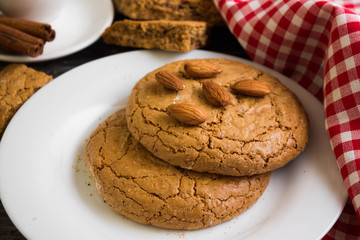 Cookies with almonds on a white plate. Tasty dessert.