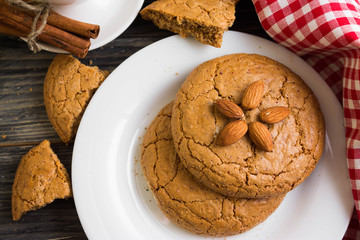 Cookies with almonds on a white plate. Tasty dessert.