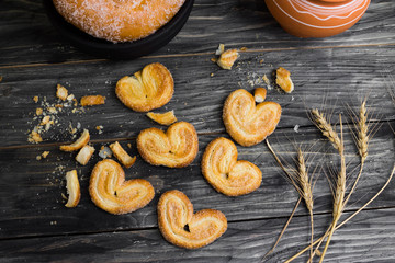 Berliner biscuits on a wooden table in rustic style and ingredients. Tasty dessert.