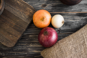 Onion on a wooden background in rustic style