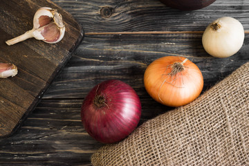 Onion on a wooden background in rustic style