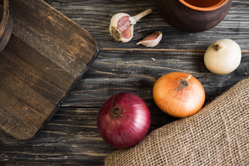 Onion on a wooden background in rustic style