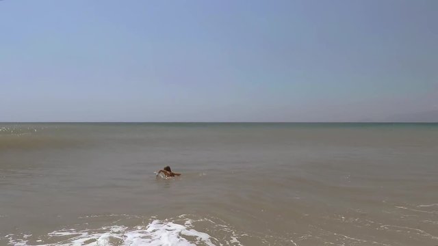 Child, Little Girl Swimming in Sea Water, young Lady plays in surf, beach