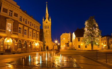 Naklejka premium Medieval church of Saint John and night old town view of Cesis, Latvia.