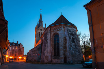 Naklejka na ściany i meble Old town street and church at summer night. Cesis, Latvia