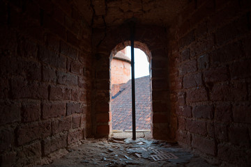 Small window - embrasure. Ruins of medieval Turaida castle in Latvia.