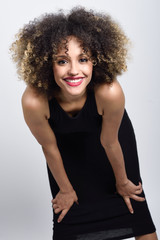 Young black woman with afro hairstyle smiling