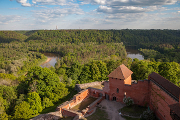Ruins of medieval Turaida castle with clock tower in Latvia. Summer daytime.