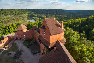 Fototapeta na wymiar Ruins of medieval Turaida castle with clock tower in Latvia. Summer daytime.