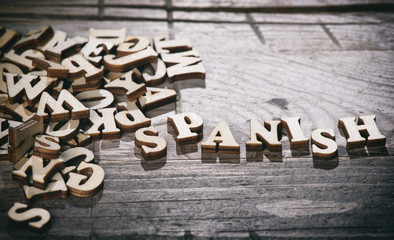 Word spanish made with wooden letters.