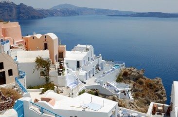 Piece of Mediterranean cruise On Santorini island, Greece. The view from the hotel on the lower terrace and the shore of the Aegean sea. characteristic architecture blue and white tones in the decor