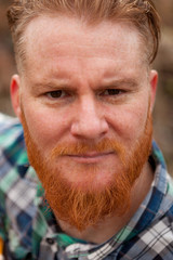 Portrait of red haired man with long beard