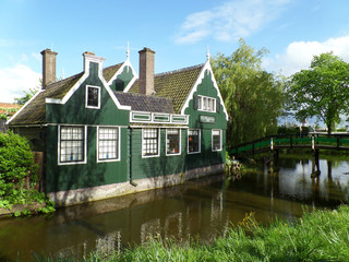 Fototapeta na wymiar Dutch Style Green and White Colored Wooden House, Netherlands