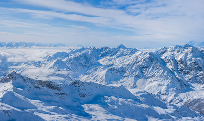 Fototapeta na wymiar Panoramic view of Italian Alps from Plateau Rosa in the winter in the Aosta Valley region of northwest Italy.