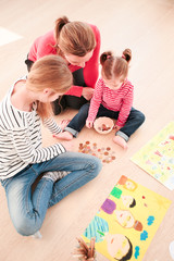Children counting money earned during school fair