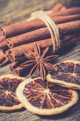 Cinnamon stick on old vintage wooden table. Christmas spices background