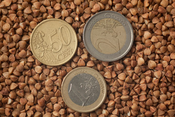 coins on buckwheat, closeup studio shot