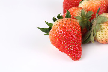 Delicious strawberries on a white background
