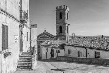 The central Piazza Magenta square in the historic center of Manciano, Grosseto, Tuscany, Italy, on a sunny day, in black and white