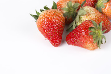 Delicious strawberries on a white background