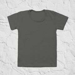 Grey blank t-shirt on dark stone background