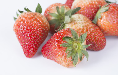Delicious strawberries on a white background