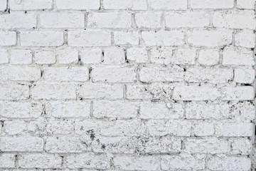Old white concrete wall with cracks