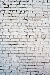 Old white concrete wall with cracks