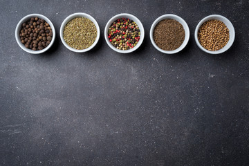 Herbs and spices in white bowls