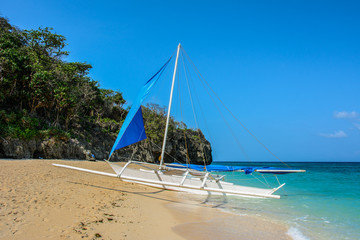 White boat on the beach of Boracay Island, Philippines