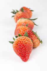 Delicious strawberries on a white background