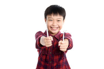 Dentist checking young asian boy teeth