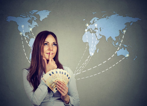 Thinking Woman With Euro Cash Deciding On Next Travel Destination