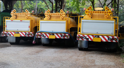 yellow truck for watering a tree on roadside in Bangkok