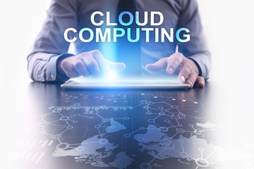 Businessman is using tablet pc and selecting cloud computing.