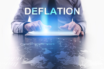 Businessman is using tablet pc and selecting deflation.