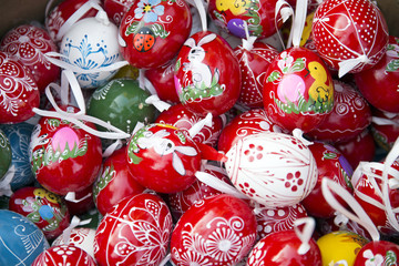 Heap of many colorful hand painted homemade easter eggs on retail market