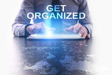 Businessman is using tablet pc and selecting get organized.
