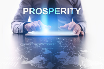 Businessman is using tablet pc and selecting prosperity.